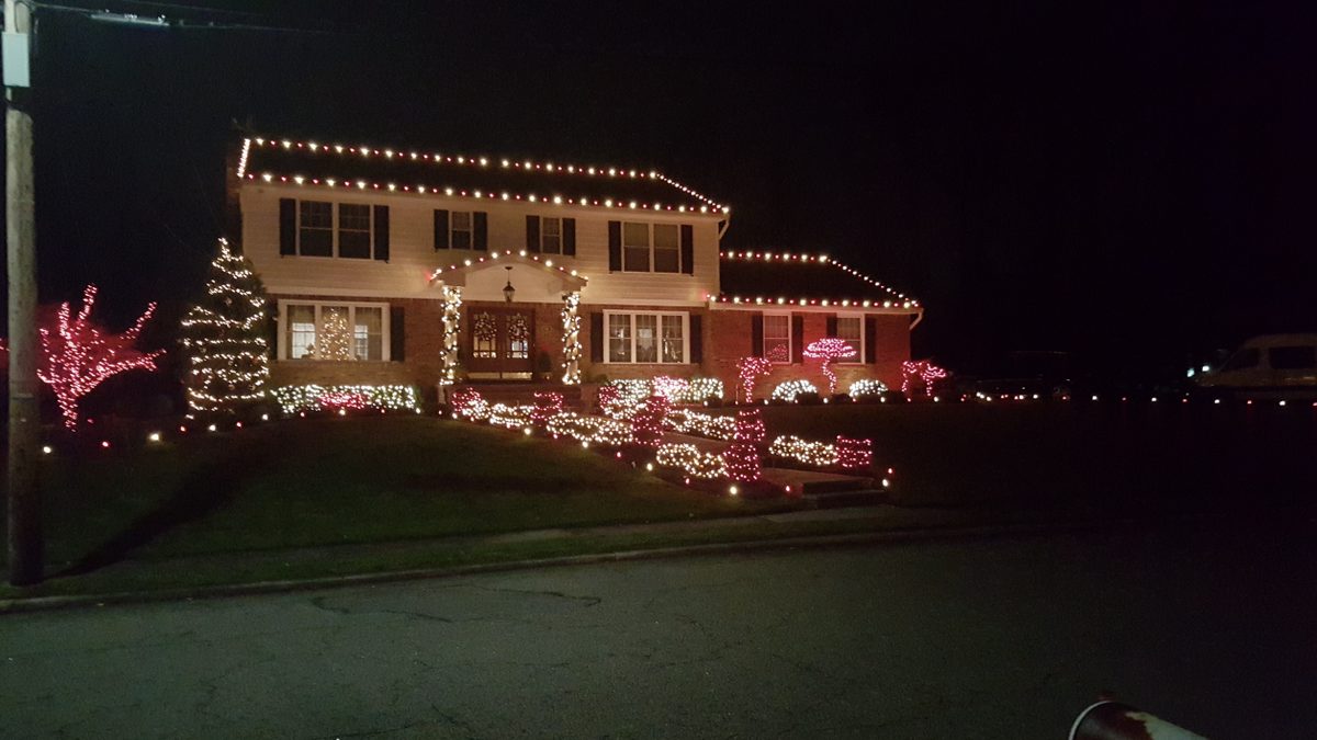 Front yard with red and white themed lighting